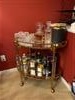 Normandy Modern Classic Gold Leaf Metal Clear Glass Bar Cart Image 1